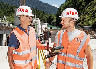 Two surveyors on the construction site