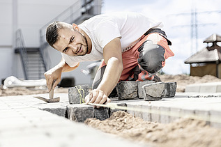 Photo: Marcel  laying paving stones