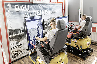 Photo Anne Killmer in the state-of-the-art excavator simulator